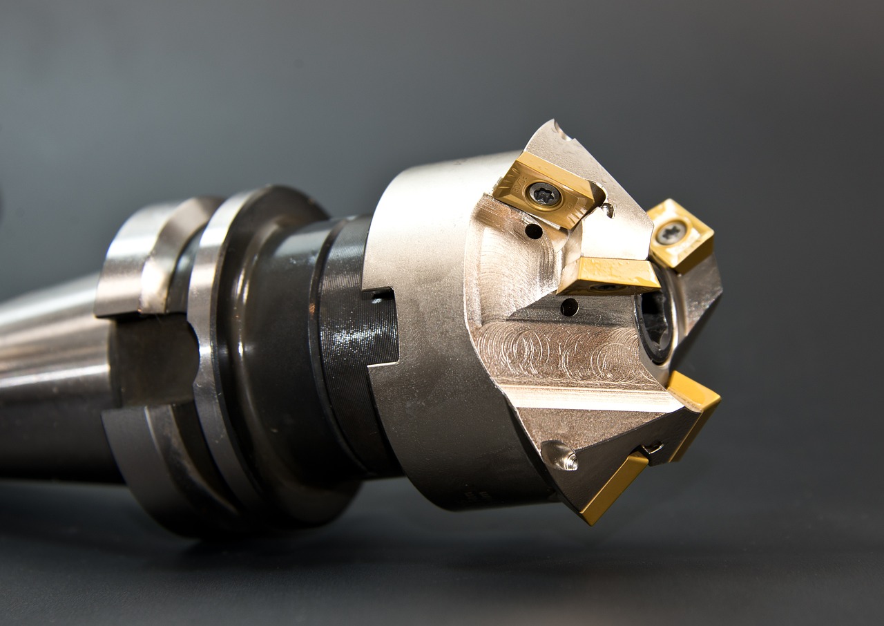 Metal tool with gold inserts Metal tool with gold inserts